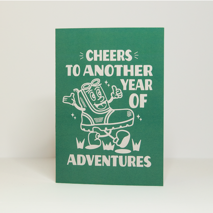 'Cheers to another year of adventures' hiking card